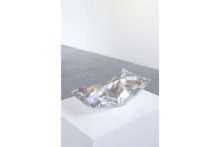 G. Küng, Package, 2018, Aluminum foil, paint, paper, 40 x 22 x 16 cm